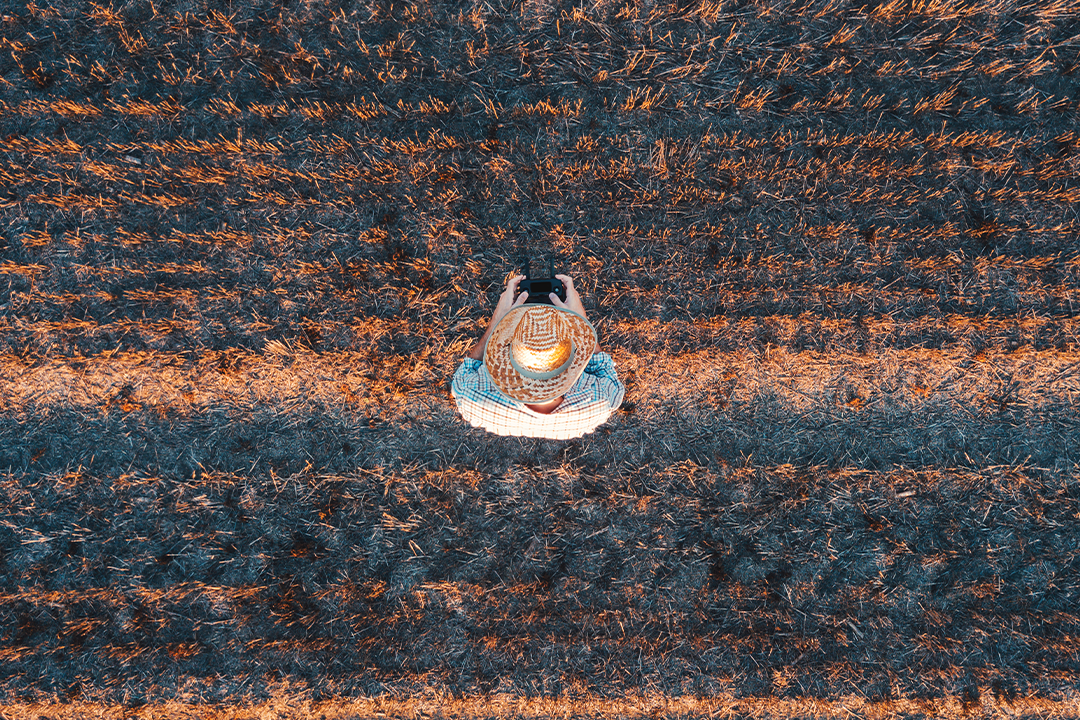 Farmer using agricultural drone
